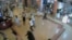 FILE - Shoppers flee during an attack by gunmen, inside the Westgate shopping mall in this still frame taken from video footage by security cameras inside the mall in Nairobi, Kenya, released on Oct. 17, 2013.