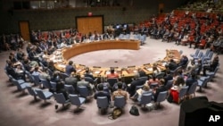 FILE - The U.N. Security Council holds a meeting at U.N. headquarters. 