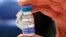 FILE - A nurse holds a vial of measles, mumps and rubella vaccine at Boston Children's Hospital in Boston, Mass., Feb. 26, 2015.