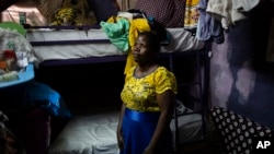 FILE - Margaret Oliele, a former detained patient, poses for a portrait in her home in Nairobi, Kenya, Sept. 8, 2018.