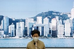 Hong Kong's Chief Executive Carrie Lam holds a news conference after four pro-democratic legislators were disqualified when Beijing passed a new dissent resolution, in Hong Kong, Nov. 11, 2020.