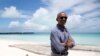 President Barack Obama looks stands at Turtle Beach to speak to the media as he tours Midway Atoll in the Papahanaumokuakea Marine National Monument, Northwestern Hawaiian Islands.