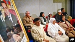 FILE - Alleged victims of repression attend public hearings in Rabat of the Moroccan Equity and Reconciliation Commission, Dec. 21, 2004. The hearings gave a platform to victims of human rights abuses dating back decades.