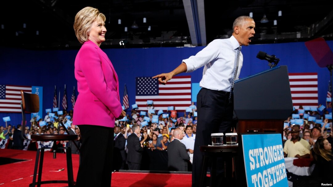President Barack Obama points to Democratic presidential candidate Hillary Clinton during a Clinton campaign event in Charlotte, North Carolina, July 5, 2016. 