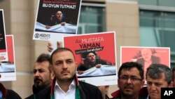 Turkish lawyers hold a protest outside Istanbul's court, July 17, 2017, demanding the release of Mustafa Yaman, a lawyer who according to Turkish media was detained earlier this month. 