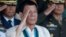 Philippine President Rodrigo Duterte salutes with military officers during a anniversary celebration of the Armed Forces at a military camp in Quezon city, Manila, Dec. 21, 2016.