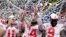 Ohio State wide receiver K.J. Hill (14) holds the trophy following the team's 34-21 win over Wisconsin in the Big Ten championship NCAA college football game, Dec. 8, 2019, in Indianapolis.
