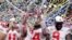 Ohio State wide receiver K.J. Hill (14) holds the trophy following the team's 34-21 win over Wisconsin in the Big Ten championship NCAA college football game, Dec. 8, 2019, in Indianapolis.