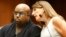 Grammy Award winning R&B singer and "The Voice" TV judge CeeLo Green (L), confers with attorney Blair Berk in Clara Shortridge Foltz Criminal Justice Center in Los Angeles, California, Oct. 21, 2013.