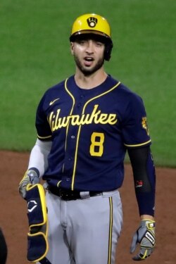 Milwaukee Brewers' Ryan Braun stands on second base after driving in two runs with a double during the ninth inning of a game in Pittsburgh, July 27, 2020.