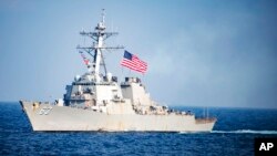 FILE - U.S. Navy destroyer USS Stethem transits waters east of the Korean Peninsula during a photo exercise including the U.S. Navy and South Korean Navy during the Operation Foal Eagle. 