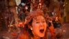 A reveller covered in tomato pulp participates in the annual Tomatina festival in the eastern town of Bunol, near Valencia, Spain.