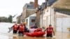 Rescue workers pull residents on a small boat after storm Herminia has unleashed downpours on the region, Jan. 27, 2025 in in the village of Guipry Messac, western France.