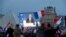 President-elect Emmanuel Macron is seen on a giant screen near the Louvre museum after results were announced in the second round of voting in the 2017 French presidential elections, in Paris, France, May 7, 2017.