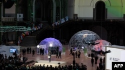 Attendees listen to a speech during a closing event for the first day of the Artificial Intelligence (AI) Action Summit, at the Grand Palais, in Paris, on Feb. 10, 2025. 