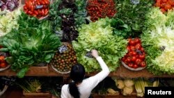 FILE - Vegetables are a staple of DASH, considered the best overall diet. They’re celebrated at the Italian food hall chain Eataly’s flagship store in downtown Milan. 