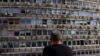 (FILE) A man looks at a building damaged at the site of an explosion, amid the Israel-Hamas conflict in Tel Aviv, Israel July 19, 2024. 