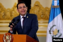 FILE - Guatemala's President Jimmy Morales delivers a message at the National Palace of Culture in Guatemala City, Guatemala, Sept. 6, 2018.