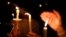 People attend a candlelight vigil for victims of yesterday's shooting at nearby Marjory Stoneman Douglas High School, in Parkland, Florida, U.S. Feb. 15, 2018. 