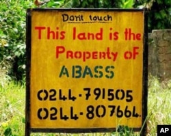 A sign marks private property in Angola.