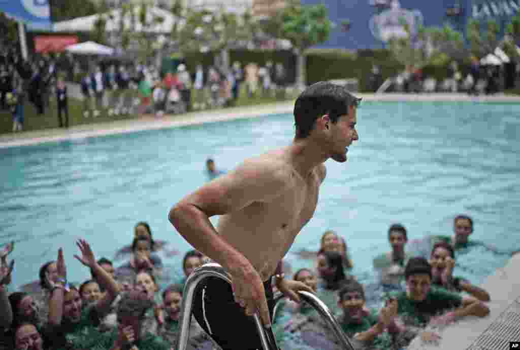 Dominic Thiem of Austria gets out of the pool after jumping in with ball boys and girls following his victory in the final of the Barcelona Open Tennis Tournament against Daniil Medvedev of Russia in two sets 6-4, 6-0, in Barcelona, Spain.