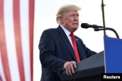 FILE PHOTO: Former U.S. President Donald Trump holds a rally in Mendon