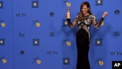Allison Janney poses in the press room with the award for best performance by an actress in a supporting role in any motion picture for "I, Tonya" at the 75th annual Golden Globe Awards Sunday, Jan. 7, 2018, in Beverly Hills.