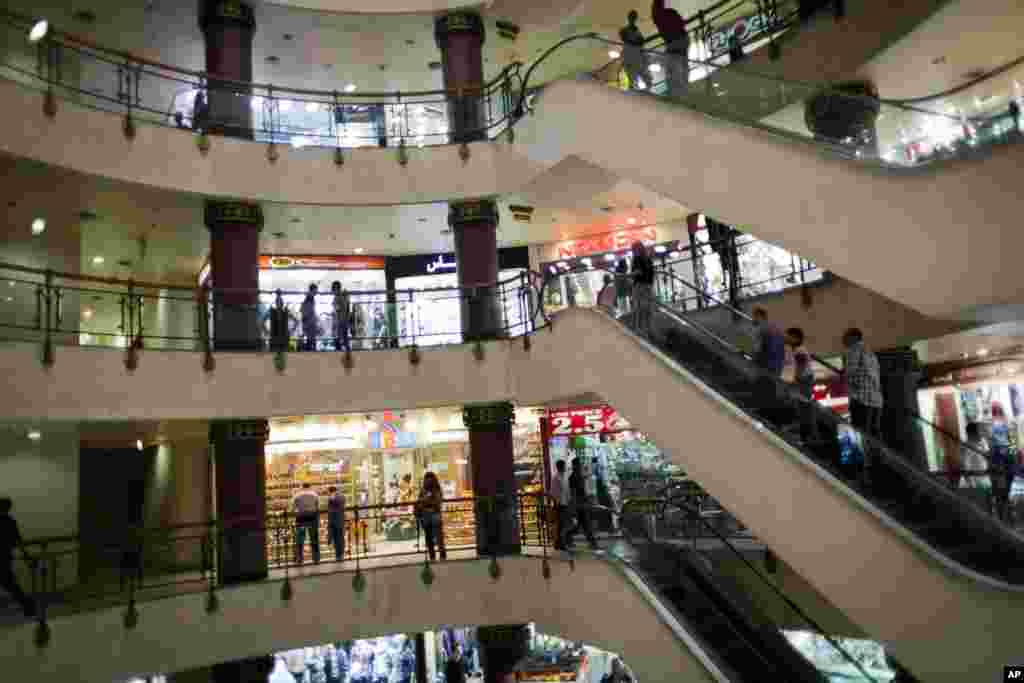 Egyptian shoppers roam a commercial mall in Cairo, Egypt, Oct. 31. The government is facing a backlash from businesses and the public as it vows to impose new nationwide rules closing stores and restaurants early