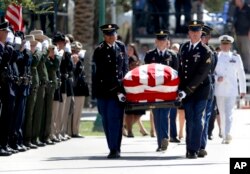 The Arizona National Guard carries the casket of Sen. John McCain, R-Ariz. during memorial service at the Arizona Capitol in Phoenix, Aug. 29, 2018.