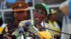 FILE: Zimbabwe President and Zanu-PF leader Robert Mugabe addresses party supporters at his last campaign rally in Harare, July, 28, 2013.