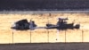 Search and rescue efforts are seen around a wreckage site in the Potomac River from Ronald Reagan Washington National Airport, Jan. 30, 2025, in Arlington, Va. 