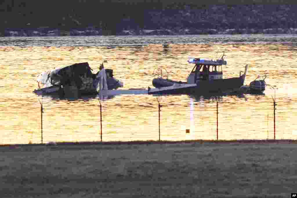 Search and rescue efforts are seen around a wreckage site in the Potomac River from Ronald Reagan Washington National Airport, Jan. 30, 2025, in Arlington, Va. 