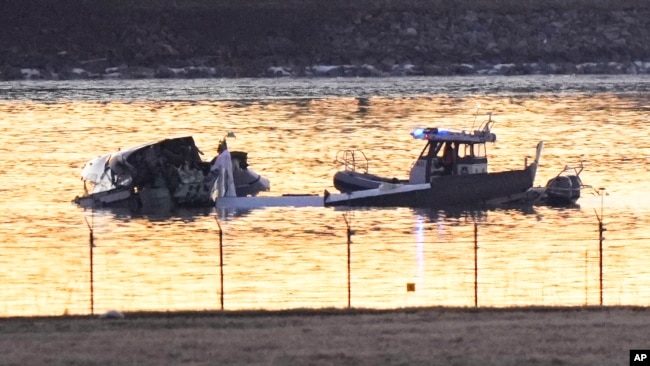 In photos: Passenger jet and military helicopter collide in Washington