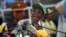 FILE: Zimbabwe President and Zanu-PF leader Robert Mugabe addresses party supporters at his last campaign rally in Harare, July, 28, 2013.