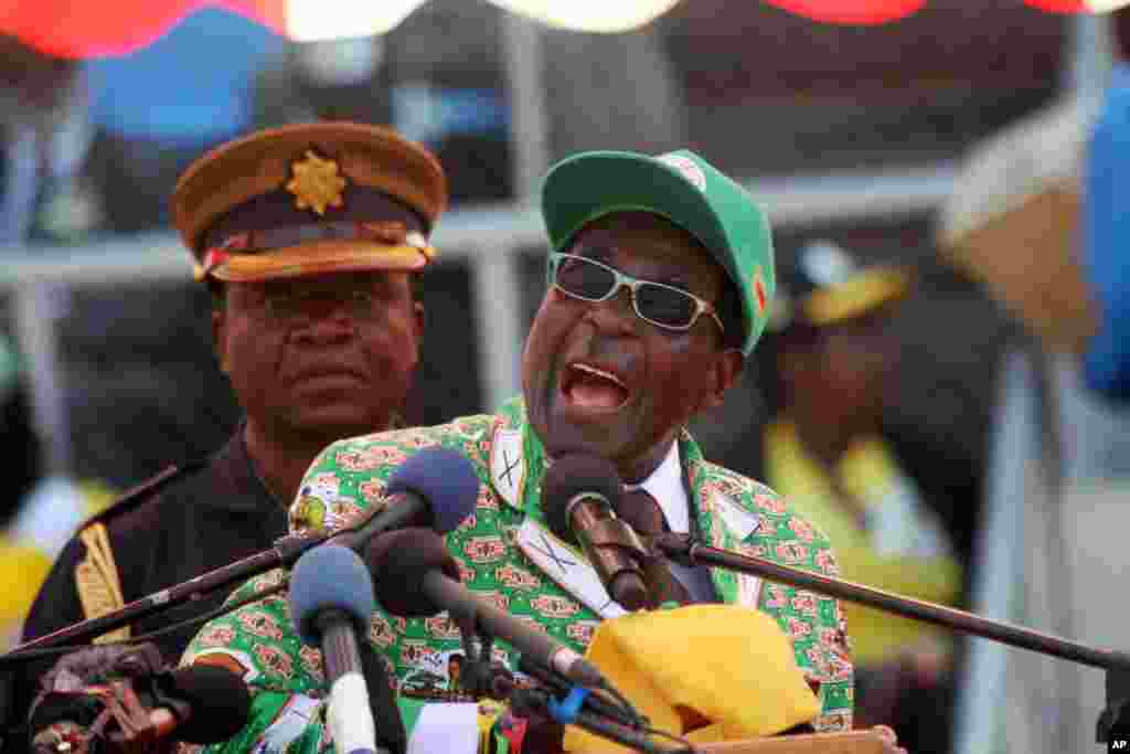Zimbabwe President and Zanu-PF leader Robert Mugabe addresses party supporters at his last campaign rally in Harare, July 28, 2013.