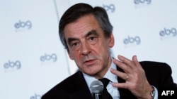French presidential election candidate for the right-wing Les Republicains (LR) party Francois Fillon gestures as he speaks during a debate organized by the EBG (Electronic Business Group), Jan. 31, 2017, in Paris.