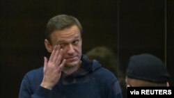 Russian opposition leader Alexei Navalny, accused of flouting the terms of a suspended sentence for embezzlement, attends a court hearing in Moscow, Russia, Feb. 2, 2021.