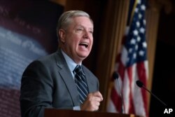 FILE - Senate Judiciary Committee Chairman Lindsey Graham, R-S.C., denounces a report by the Justice Department's internal watchdog, on Capitol Hill in Washington, Dec. 9, 2019.