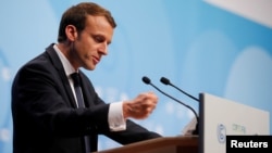 FILE - French President Emmanuel Macron speaks during the COP23 U.N. Climate Change Conference in Bonn, Germany, Nov. 15, 2017. 