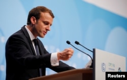 FILE - French President Emmanuel Macron speaks during the COP23 U.N. Climate Change Conference in Bonn, Germany, Nov. 15, 2017.