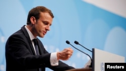 FILE - French President Emmanuel Macron speaks during the COP23 U.N. Climate Change Conference in Bonn, Germany, Nov. 15, 2017. 