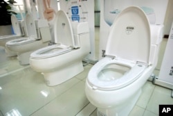 High-end Trump-branded toilets made by Shenzhen Trump Industrial Co. are on display at the company's offices in Shenzhen, China, Feb. 13, 2017. President Donald Trump recently secured trademark rights to his own name in China, after suffering rejection af