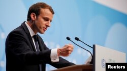 FILE - French President Emmanuel Macron speaks during the COP23 U.N. Climate Change Conference in Bonn, Germany, Nov. 15, 2017. 