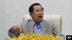 Cambodia's Prime Minister Hun Sen gestures during a speech on the current state of a new virus from China in Phnom Penh, Cambodia, Jan. 30, 2020. 