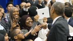 President Barack Obama greets Al-Rahmah schoolchildren and other guests while visiting the Islamic Society of Baltimore in Maryland, Feb. 3, 2016.