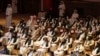 FILE - Members of the Taliban delegation attend the opening session of the peace talks between the Afghan government and the Taliban in the Qatari capital Doha, Sept. 12, 2020. 
