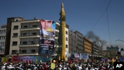 FILE - A ballistic missile is displayed by Iran's Revolutionary Guard at a pro-Palestinian rally marking Al-Quds (Jerusalem) Day, in Tehran, Iran, June 23, 2017.