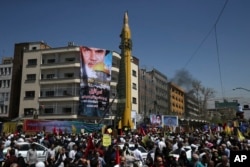 FILE - A ballistic missile is displayed by Iran's Revolutionary Guard at a pro-Palestinian rally marking Al-Quds (Jerusalem) Day, in Tehran, Iran, June 23, 2017.