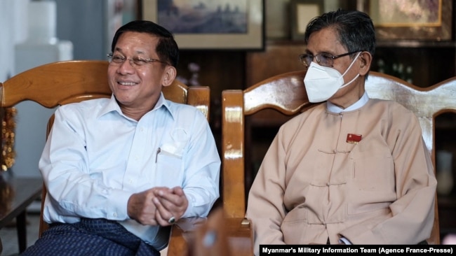 Myanmar's armed forces chief Senior General Min Aung Hlaing meets National League for Democracy (NLD) patron Tin Oo (R) at Tin Oo's home in Yangon, Dec. 5, 2021.