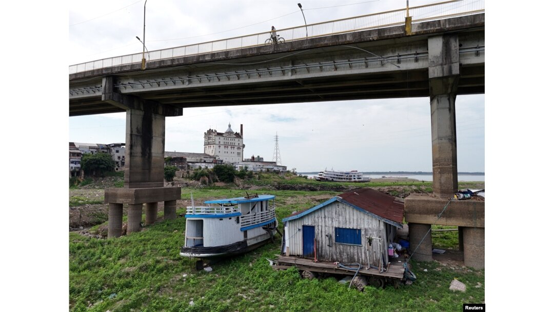 A drone view shows floating houses stranded on the Rio Negro as the river reached its lowest point in its history during the most widespread drought Brazil has experienced since records began in 1950, in Manaus, Amazonas state, Brazil Oct. 4, 2024.